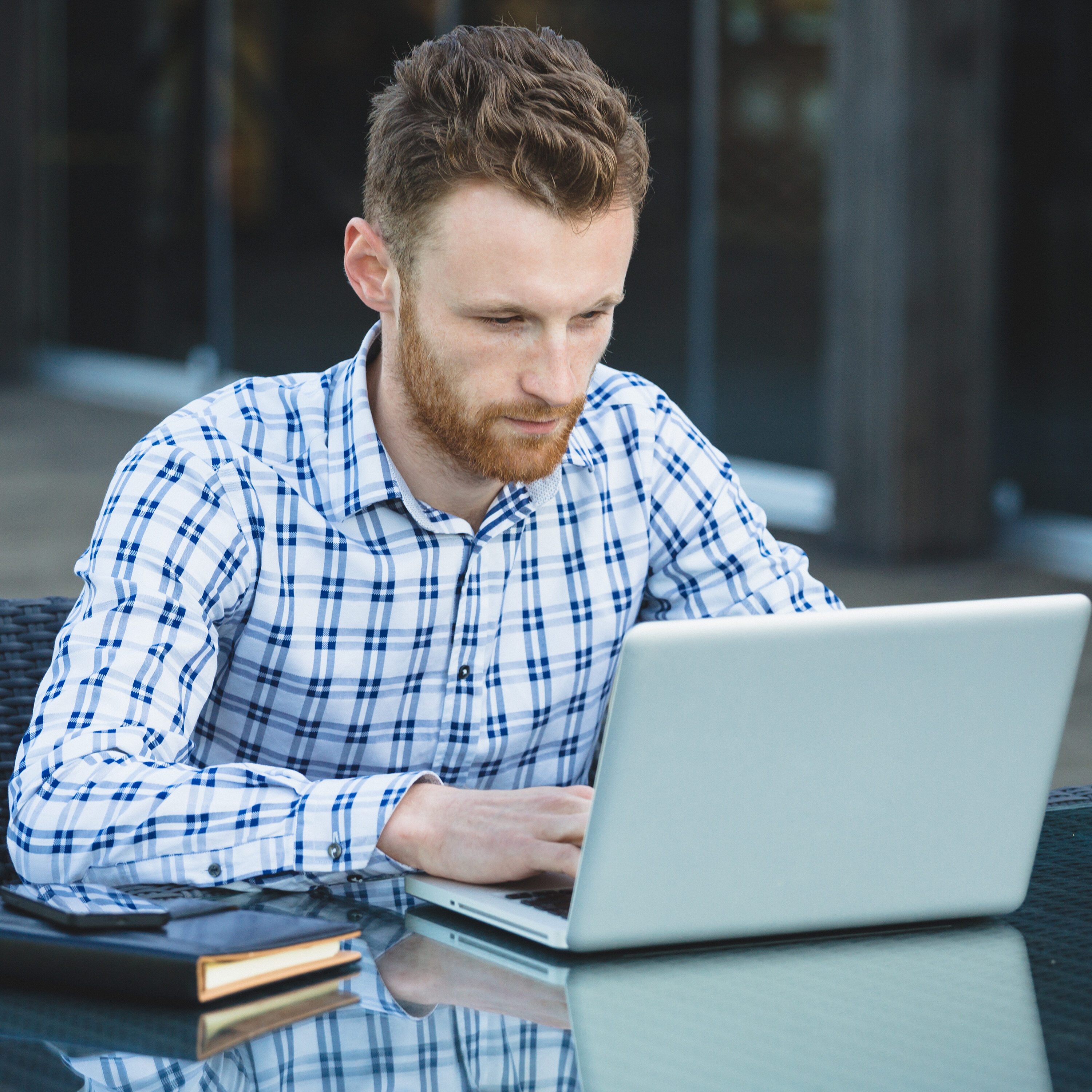 Handsome businessman working with laptop